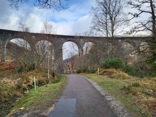 path with viaduct arches to the front