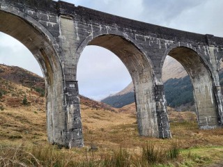 Viaduct arches with mountains in backgr