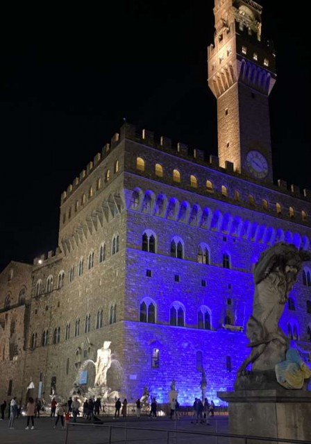 Palazzo Vecchio, Florence's Town Hall, lit up with blue lights at night