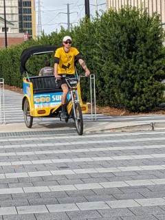 A Pedicab driver heading to the convention center to wait for his new passengers